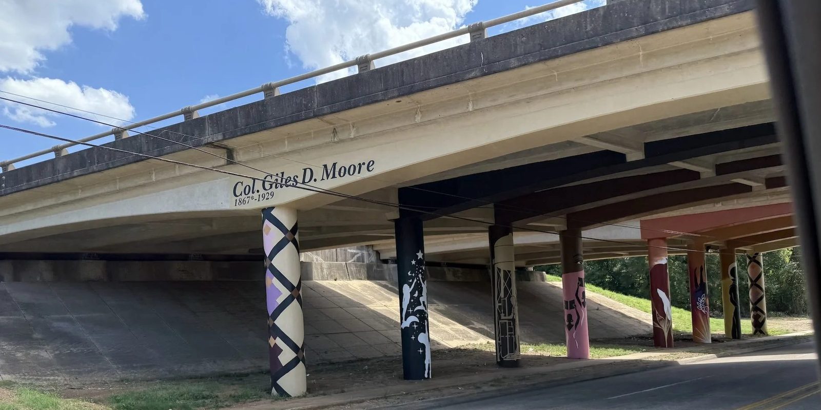 The Col. Giles D. Moore overpass in Mooretown, its concrete columns painted with murals